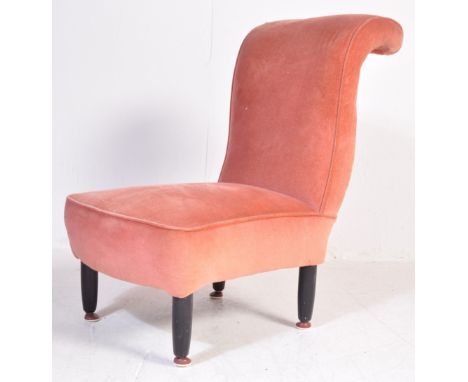 A retro vintage mid 20th century boudoir / salon / nursing chair having a scrolled back rest, upholstered in pink velour fabr
