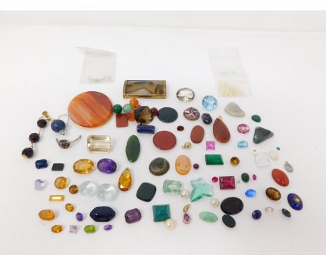 A collection of various cut gemstones, crystal and gemstone beads. Including Smokey Quartz, Amethyst, Opal, Chrysophrase, See