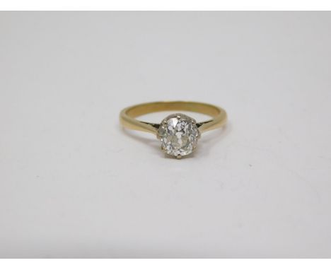 A 1.10 carat cushion shape old mine diamond solitaire ring. Set with a cushion shape old mine diamond with an approximate wei