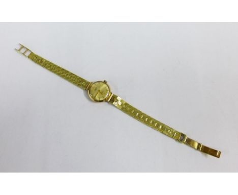 Lady's vintage gold cased Rotary wrist watch on a 14ct gold bracelet strap 