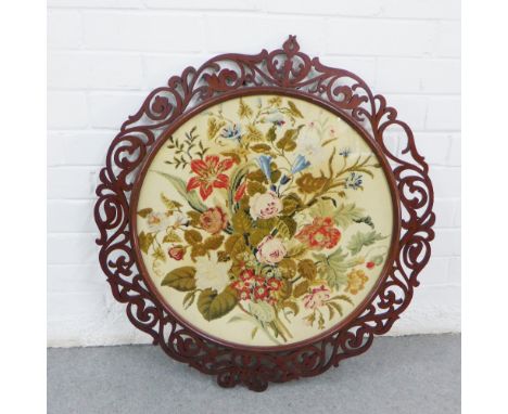 Large circular panel, likely from a pole screen, within a fretwork frame, 74 x 67cm 