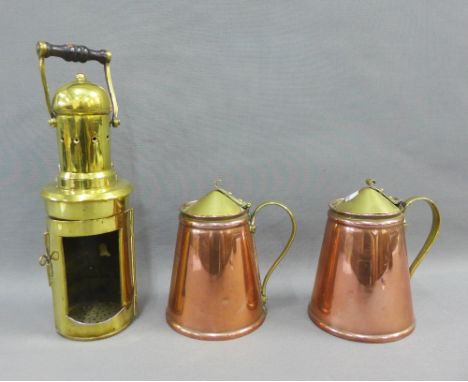 A pair of WAS Benson Patent copper and brass jugs, 14cm high, and a brass lantern case, (3)