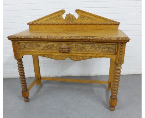 Carved oak side table, with a broken pediment ledgeback, single frieze drawer, bobbin legs and undertier, 98 x 108 x 42cm 