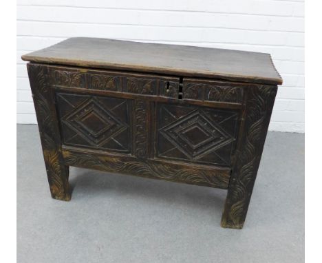 17th century oak coffer, with carved front panel, lift up top and void interior, 61 x 84cm 