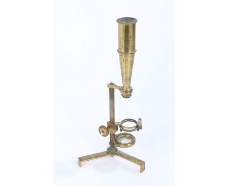 Brass monocular travel microscope, the adjustable central stem raised on a folding tripod base, 28cm high