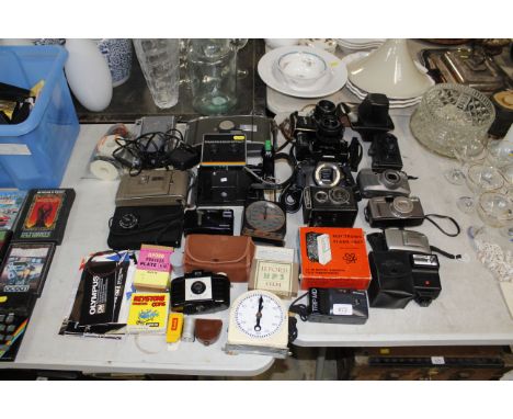 A quantity of various cameras and accessories to include Polaroid; Canon; Olympus etc