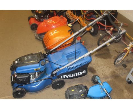 A Hyundai petrol rotary self propelled rotary lawnmower with Hyundai 139cc OHV engine and grass collection box
