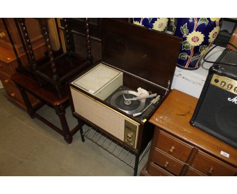 A vintage Deka dream pick up record player with garrard turn table sold as collectors item