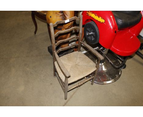 A rush seated child's ladder back chair AF