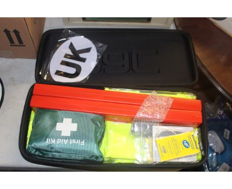 An RAC Euro car emergency kit comprising of two triangle warning signs in plastic cases; first aid kit; hi vis vests; torch e
