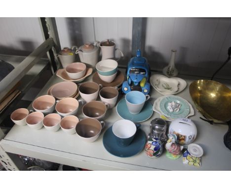 A collection of Poole twin tone teaware, novelty teapot, money box and other decorative china