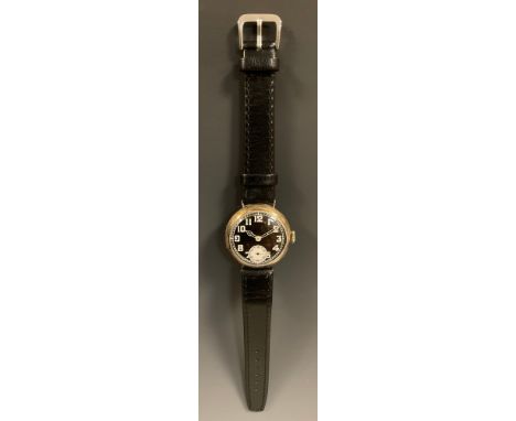 A World War I period trench watch, 33mm silver case, black dial, bold white Arabic numerals, subsidiary seconds, Swiss silver