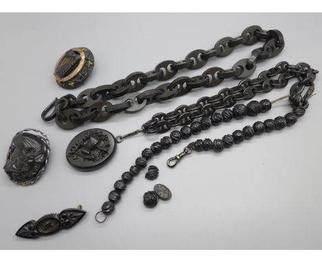 A collection of Victorian and later jet including a brooch with Irish harp and gold overlay, a/f, one other brooch and a pend