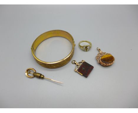 Two 9ct gold swivel fobs, a Victorian 9ct gold horseshoe  stick pin, a silver gilt ring, N, and a rolled gold bangle, (total 