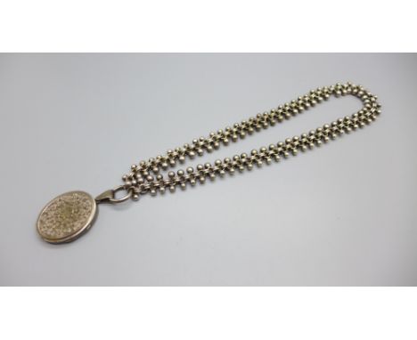 A Victorian locket and chain 