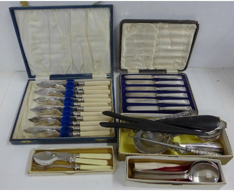 A cased set of six silver handled knives, fish knives and forks, two button hooks and a shoe horn with silver handles and oth