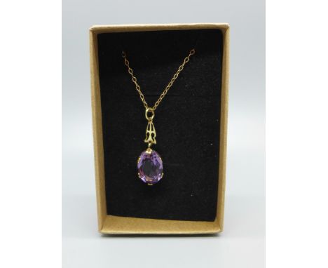 A 9ct gold and amethyst pendant on a yellow metal chain, fastener a/f, 2.7g 