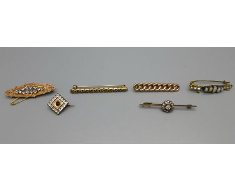 A yellow metal chain link brooch, mark worn, and a cluster bar brooch marked 9ct, and four other brooches 