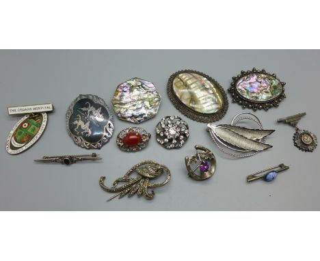 A silver thistle brooch, a 900 silver paste set brooch, a silver and enamel Nottingham and Ilkeston Group Training Schools ba