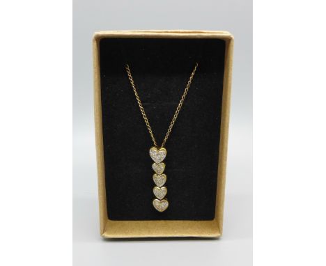 A 9ct gold pendant set with twenty diamonds on a fine 9ct gold chain, 2.2g 