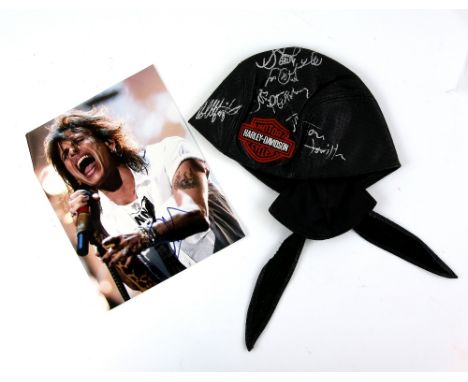 Aerosmith - Leather Harley Davidson cap signed by Steve Tyler, Joe Perry, Tom Hamilton, Joe Kramer and Brad Whitford, with a 