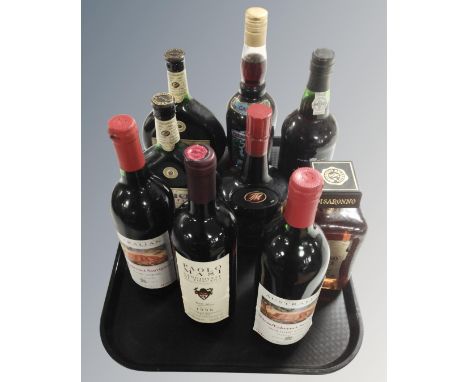 A tray containing nine bottles of alcohol including Disaronno, Tia Maria, port, wine etc.