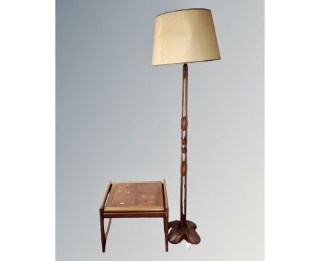 A 20th century teak tiled topped occasional table, together with 20th century stained beech standard lamp and shade 