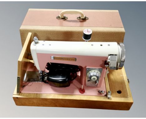 A vintage Seamstress electric sewing machine.