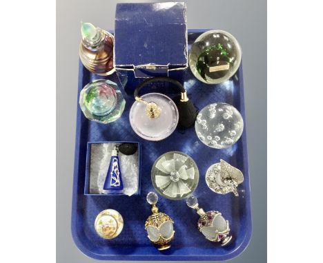 A tray containing decorative glass perfume bottles together with Teign valley glass paperweights and a Delprado ceramic trink