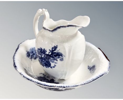 A 19th century blue and white rose patterned wash jug and basin.