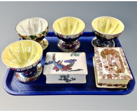 A tray containing four Maling lustre sundae dishes together with two Maling lustre lidded trinket boxes.