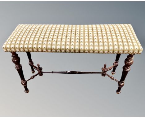 A rectangular window seat in studded tapestry upholstery with turned beech understretcher. (length 91cm)
