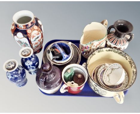 A tray containing assorted ceramics including Chinese vases, Montrose pottery decanter, miniature bottles, tea ware, King Geo