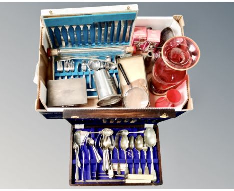 A box containing vintage glass rolling pin, glass vases, plated wares, canteens of cutlery.