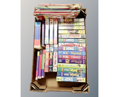 A box containing five Harry Potter paperback volumes, vintage Viz comics, a quantity of VHS tapes including Disney, Stingray,