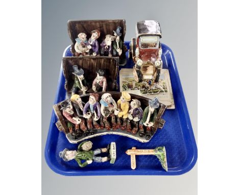 A tray containing Will Young studio pottery Widdicombe Fair figures, together with a further ceramic figure of a vintage car.