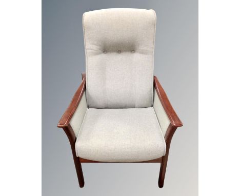 A stained beech framed high back manual reclining armchair 