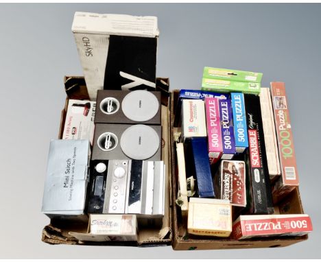 Two boxes containing vintage jigsaws and board games, Philips micro-hifi system, Sky box, Ministitch sewing machine.