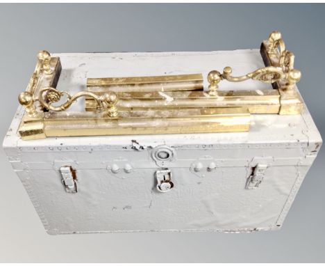 A vintage painted shipping trunk together with a brass fire curb. (AF)