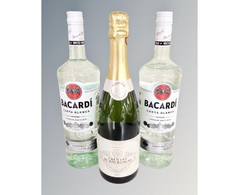 Two bottles of Bacardi Carta Blanca Superior white rum, 1l, and a bottle of Crémant de Bourgogne Brut sparkling wine, 75cl. (