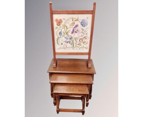 A nest of three oak tables and a tapestry fire screen 