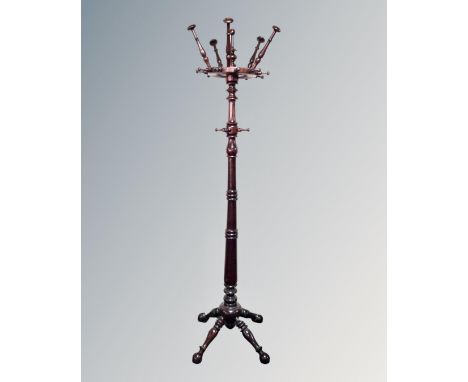 An early 20th century stained beech hat and coat stand 