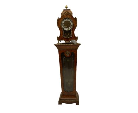 A contemporary 20th century Boulle clock case on a conforming tapered plinth with a glazed door supported on shaped bracket f