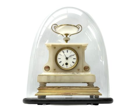 A 19th century French alabaster cased clock in a break front case with a flat top surmounted by an urn, with an eight-day Par