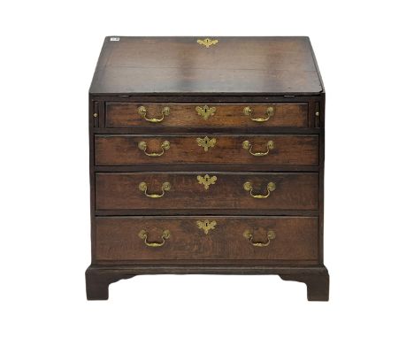 Georgian oak bureau, fall front enclosing fitted interior, four long graduating drawers, on bracket feetDimensions: Height:&n