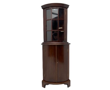 Late 20th century mahogany floor standing (W55cm, H82cm), and wall hanging (W51cm, H66cm) corner cabinets, both bowed, the wa