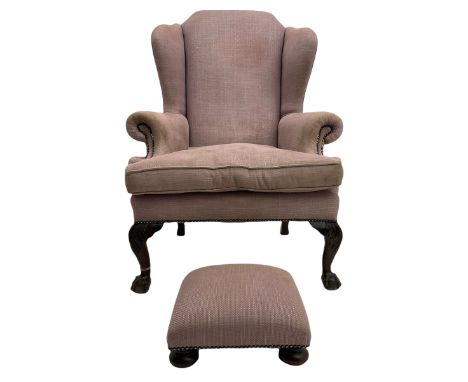 Georgian style wingback armchair, upholstered in fabric light purple fabric, on ball and claw carved front supports, with mat