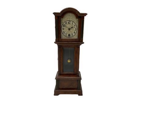 A miniature spring driven longcase clock made in Germany by the Hamburg American Clock Company c 1890, with a mahogany finish