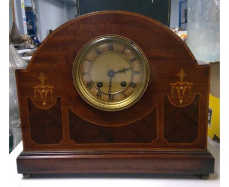 An Edwardian inlaid mahogany mantel clock with French drum movement; Roman dial and single chime.