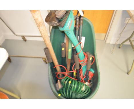 A plastic cart of gardening tools: to include: Bosch electric strimmer; pickaxe; coiled hose; and various shears.